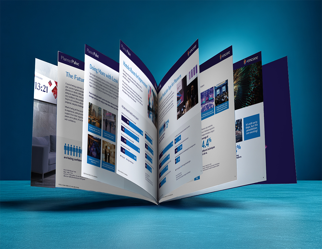 A glossy, open brochure with multiple colorful pages displayed in a fanned-out arrangement, set against a blue gradient background on a smooth surface.