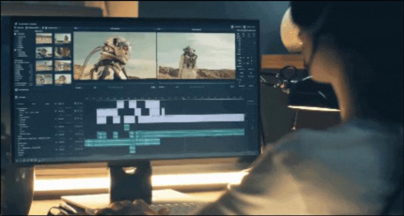 A person is editing a video on a computer, with two preview screens showing a person in a futuristic suit outdoors and a timeline with video and audio tracks displayed below.