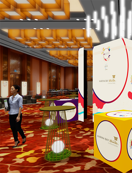 A woman walks through a modern, vibrant event space with a red and orange carpet, geometric ceiling lights, colorful signs, and Marina Bay Sands Singapore branding. Tables with decorative lights are placed throughout the room.