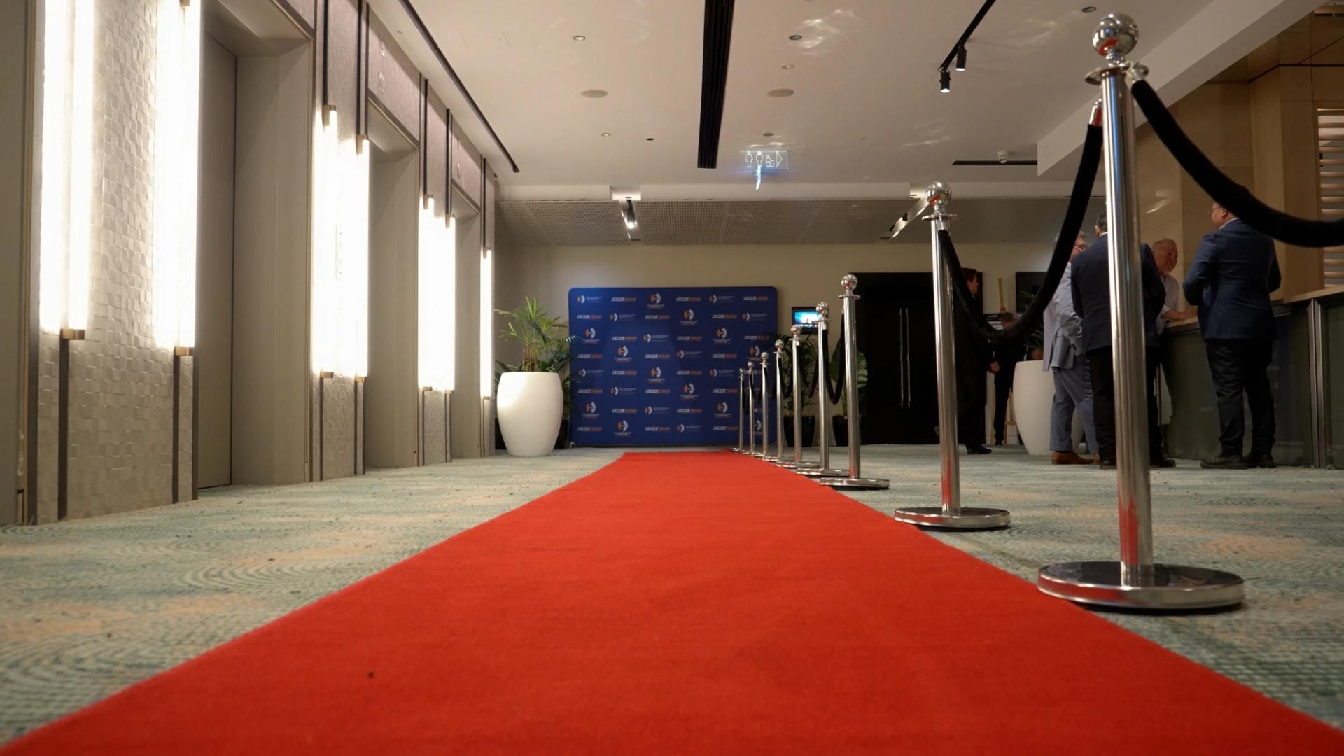 Red carpet entrance with barrier posts and branded media wall at the CCF SA Earth Awards - Encore APAC